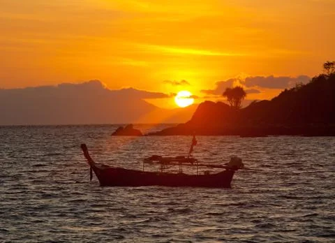 Sunset with boat Stock Photos