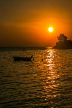 Sunset with boat Stock Photos