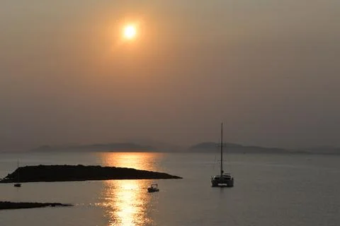 Sunset with boat Stock Photos