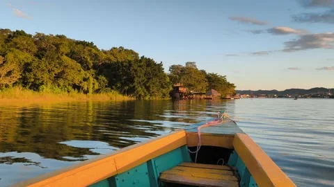 Sunset Boat Ride in Isla de Flores, Guatemala – Golden Hour Over Lake Petén Itzá Видео 331834443