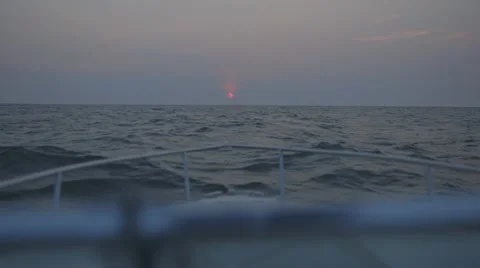 Sunset - boat rolls on water Видео 41218088