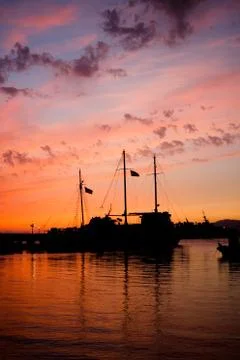 Sunset boat silhouette Stock Photos