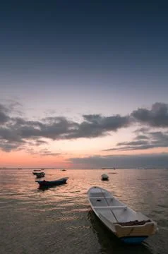 Sunset with boats Stock Photos