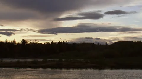 Sunset on a boreal river in autumn. Video stock 8949179