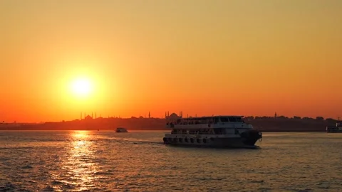Sunset in the Bosphorus strait. Ferry going to the Kadikoy in the foreground and Stock Footage 250093970