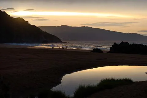 Sunset Breaking Through Clouds at Laga Beach, Basque Country Stock-Fotos