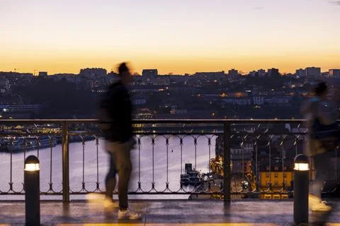 Sunset on Bridge D. Luis I with Douro River in background. Porto, Portugal. Stock Photos