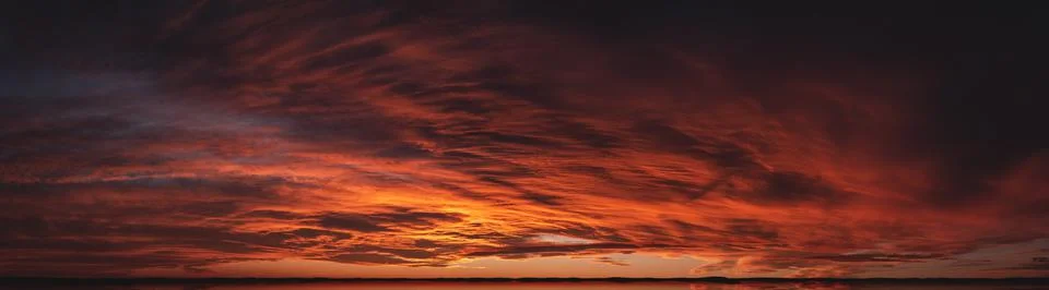 Sunset from bright saturated clouds. Dramatic sunset-sunrise with a pronounce Stock Photos
