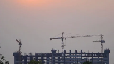 Sunset Building construction with Crane at construction site Video stock 74245264