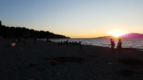 Sunset on Busy Beach Timelapse Stock-Footage 146674448