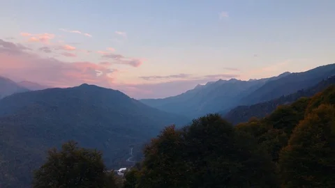 At sunset, from the cabin of the cable car, a beautiful view of the mountains. Stock Footage 106853662