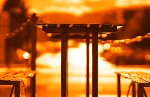 Sunset cafe table with benches backdrop Stock Photos