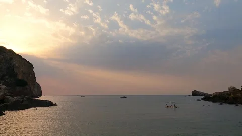 Sunset at Cala Rossa Stockbeeldmateriaal 334423880