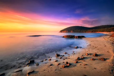 Sunset in Cala Violina bay beach in Maremma, Tuscany. Mediterranean sea. Ital Stock Photos