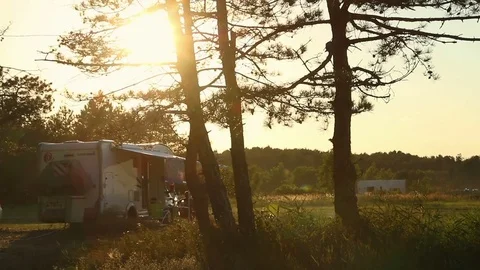 Sunset at campsite, modern caravan camper. Family adventure trip holiday 스톡 동영상 80476270