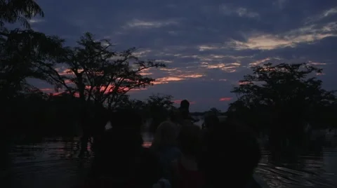 Sunset on a canoe in rainforest Stock Footage 41857180