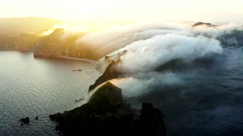 Sunset at the Cape of Four Rocks. Island. Fog and clouds. Video stock 167097970