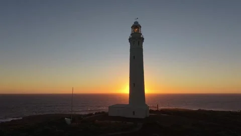 Sunset Cape Leeuwin Lighthouse Over Open Southern and Indian Oceans From Cliff Stock Footage 326571360