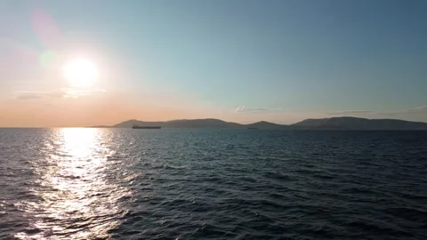 Sunset Cargo Ship Crossing Open Water near Aegina Islands Stock Footage 341472611