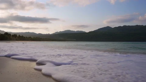 Sunset at Caribbean beach with forest in the background Stock Footage 137965625