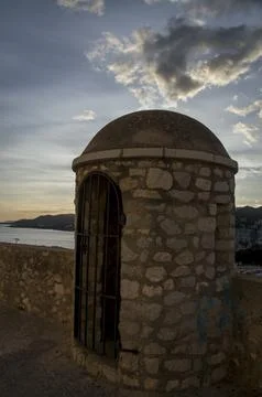 Sunset by the castle watchtower Фото