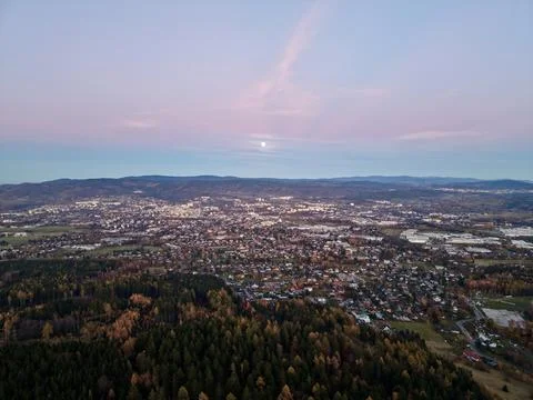 Sunset Casts Soft Glow Over Peaceful Valley Village With Tranquil Hills And.. 库存照片