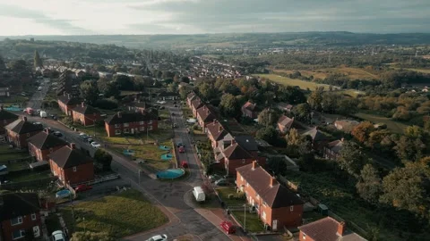 Sunset casts warm glow over quiet residential neighborhood Видео 343566656