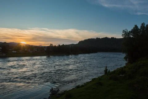 Sunset on a choppy river wind early spring landscape Stock Photos
