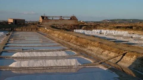 Sunset cinematic shot of salt fields after a full day of collecting salt. Stock Footage 171512905