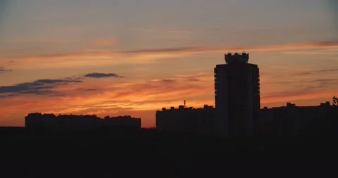 Sunset in the city. Beautiful sunset on the background of silhouettes of Stock Footage 135572664
