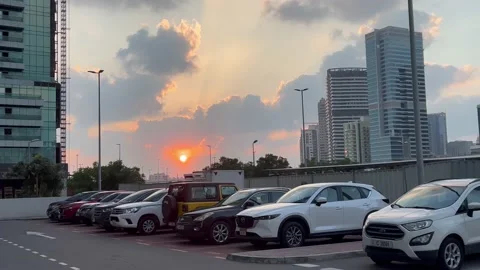 Sunset in city, clouds, with car parked on spots, summer Stock Footage 231105195