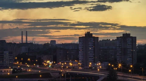 Sunset in the city.  foreground of a tall building. summer evening. Stock Footage 65094698