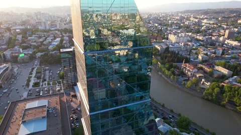Sunset city reflections on the glass skyscraper Stock Footage 194445709