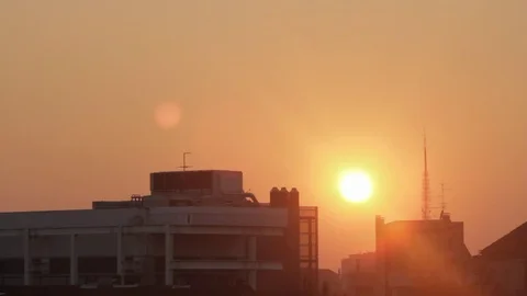 Sunset in the city  The sun sets behind the high-rise buildings Stock Footage 71231283