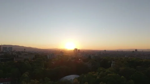 Sunset Cityscape of Sofia Bulgaria with Lush Green Parks and Urban Skyline Stock Footage 308930323