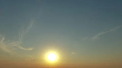 Sunset in clear blue sky 4k time-lapse video.  Evening sun shine and moving Stock Footage 68583515