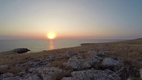 Sunset on a clear sky in the calm sea 스톡 동영상 70577164