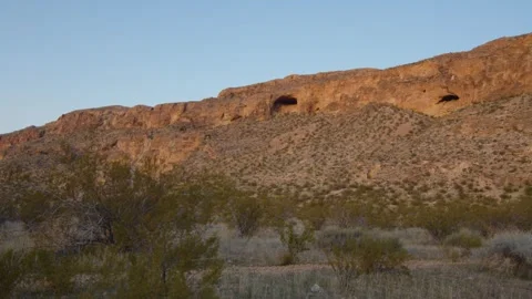 Sunset on a cliff with a cave, Hurricane, Utah, US Stock Footage 288086607