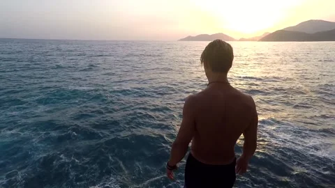 Sunset cliffdiving Stock Footage