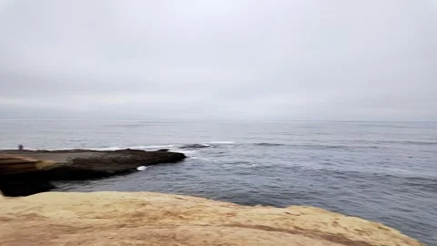 Sunset Cliffs sea cave in San Diego California spinning left shot of the Stock Footage 279541793