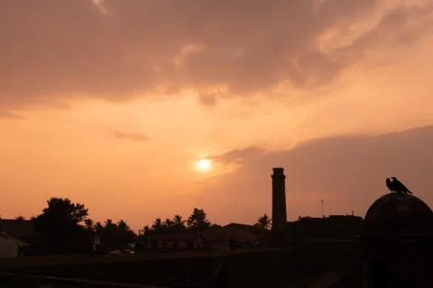 Sunset with clock tower gall sri lanka Stock Photos