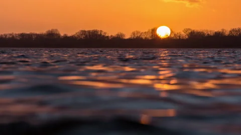 Sunset close over water foreground water Stock-Footage 153519783