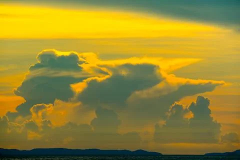 Sunset cloud back on dark silhouette sky and red flame cloud 写真素材