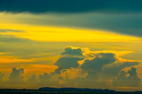 Sunset cloud back on dark silhouette sky and red flame cloud 写真素材