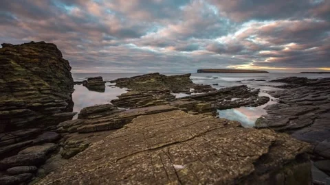 Sunset Cloud Colours on the Shoreline in Birsay Orkney HD Time Lapse 動画素材 256084152