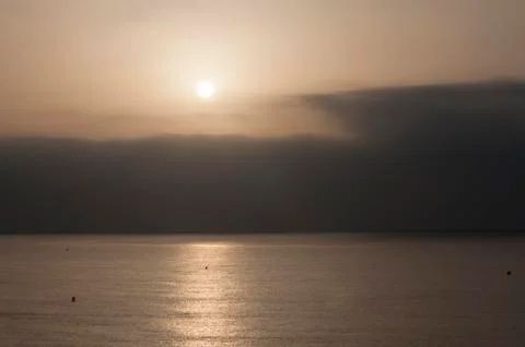 Sunset into cloud cover Stock Photos