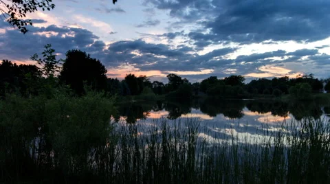 Sunset Cloud Reflection over Pond Time Lapse Stock Footage 65029151