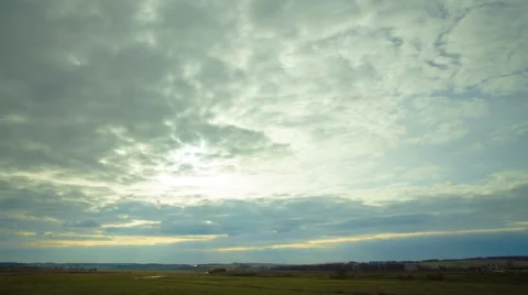 Sunset with clouds above land, wide angle. VIDEO WITH VARIABLE PLAYBACK SPEED 스톡 동영상 48954153