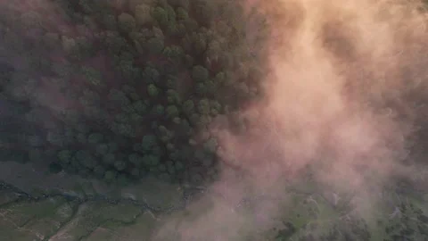 Sunset clouds above the mountain forest Stock Footage 220010875