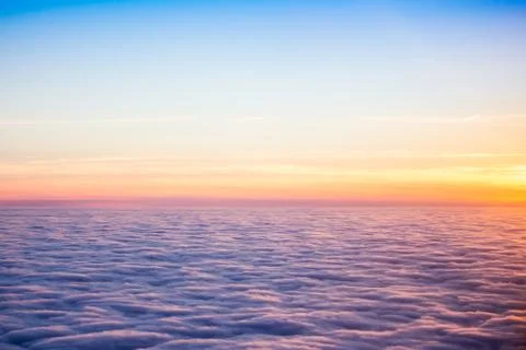 Sunset clouds from above Stock Photos